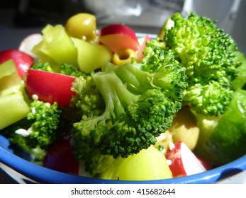 A Fresh Vegetable Salad With Brocoli, Pepper And Olives