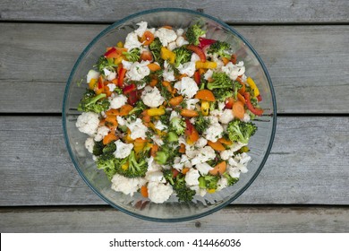 Fresh Vegetable Salad With Cauliflower, Broccoli, Carrots And Peppers In Glass Bowl, Overhead View