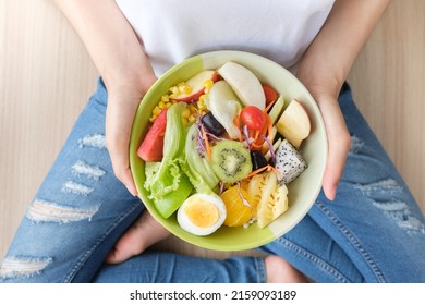 Fresh vegetable salad and healthy food with fruit, vegetables, pulses, herbs. High in anthocyanins, antioxidants, smart, minerals and vitamins for women diet slimming. Health food Concept.
