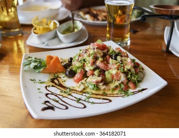 Fresh Vegetable Salad With Octopus. National Cuisine Of Montenegro. Sea Food. Appetizer Closeup 