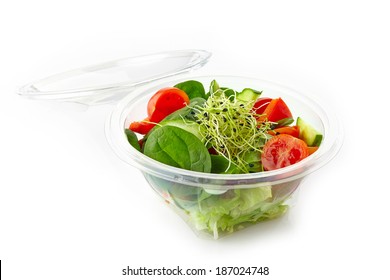 Fresh Vegetable Salad In A Plastic Take Away Bowl Isolated On White