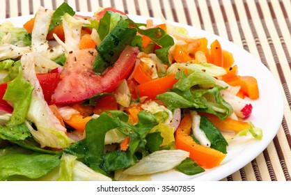 Fresh vegetable salad from tomatoes, paprika and latuce