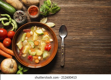 Fresh vegetable stew on wooden background overhead shoot