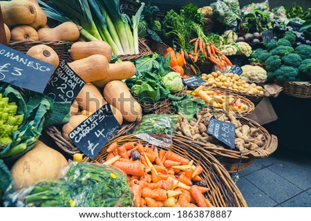 Fresh vegetables in the basket ready for sale at a fruit and veg stall  on display at Borough Market in London