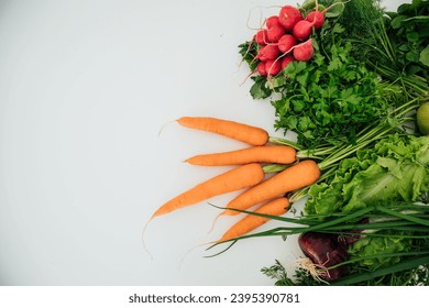 fresh vegetables for eating carrot radish green salad on white background - Shutterstock ID 2395390781