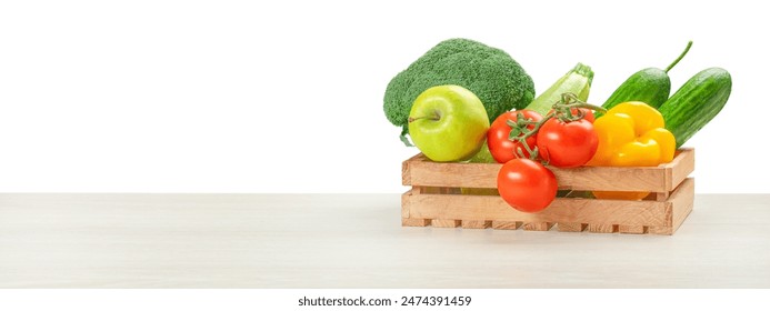 Fresh vegetables, fruits, food in a wooden box on table isolated on white. food delivery concept. - Powered by Shutterstock