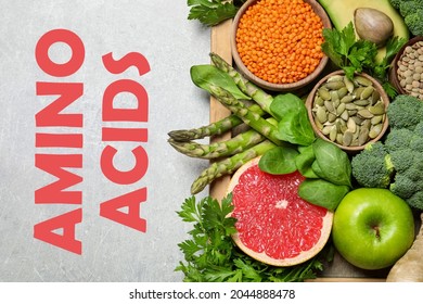 Fresh Vegetables, Fruits And Seeds On Light Grey Table, Flat Lay. Sources Of Essential Amino Acids