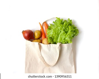 Fresh Vegetables In A Linen Bag For Shopping. Ingredients For Vegitarian Meal. Zero Waste Food, Eco Lifestyle, No Plastic Living. Healthy Organic Vitamin  Onion, Carrot, Potato, Salad Leafes Isolated