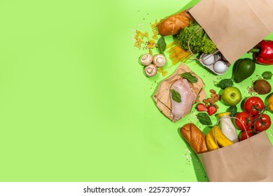 Fresh vegetables, meat, bread fruits in paper grocery bag. Delivery healthy food background. Healthy food cooking ingredients on white,background, Shopping food supermarket and clean vegan eating - Shutterstock ID 2257370957