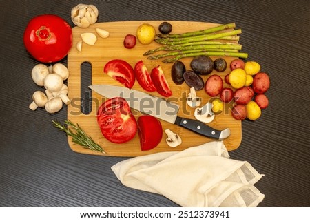Fresh vegetables on a cutting board, ready to cook ingredients