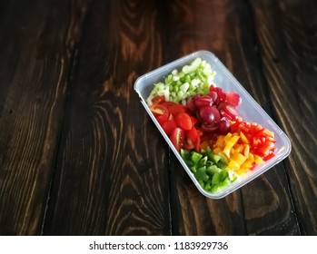 Fresh Vegetables Salad And Fruits In A Plastic Container, Ingredients For Making Pasta Salad On A Wooden Table.