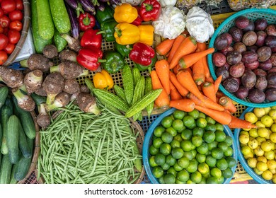 Fresh vegetables for sale at street food market in the old town of Hanoi, Vietnam. Close up, top view