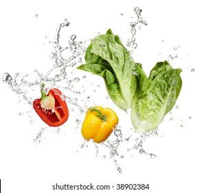 Fresh Vegetables And Water Splash On White Background