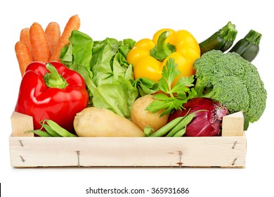 fresh vegetables in a wooden box isolated on white - Powered by Shutterstock