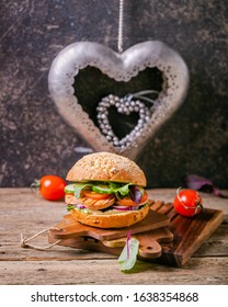 Fresh vegitarian hamburger with silver hearts for saint valentines day - Shutterstock ID 1638354868