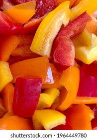 Fresh Washed And Sliced Bell Peppers In A Variety Of Colors. The Yellow, Orange, And Red Bell Peppers Are Wet, Bright, Colorful, And Clean. This Is Clean Eating Food Prep.