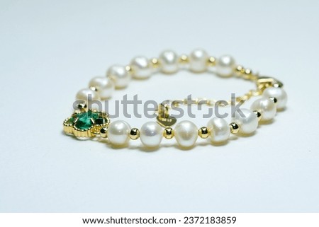 Fresh water pearl bracelet on white background 