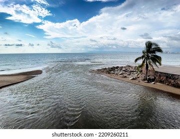 Fresh Water River Flowing Into Pacific Ocean In Puerto Vallarta, Mexico 