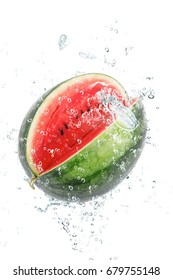 fresh watermelon falling in water