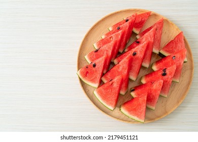 fresh watermelon sliced on wooden plate - Shutterstock ID 2179451121