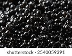  Fresh and wet natural black caviar close up. Image illustrated food for advertisement