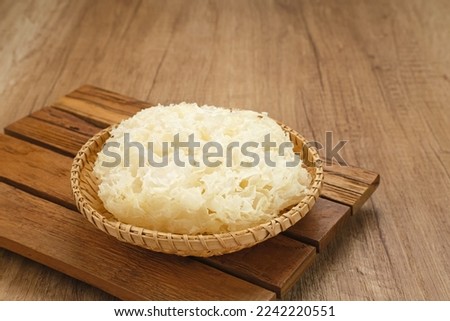 Fresh White Fungus or Snow Fungus (Tremella fuciformis) served on bamboo plate