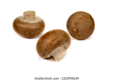 Fresh Whole Brown (Baby Bella) Mushrooms Isolated On A White Background