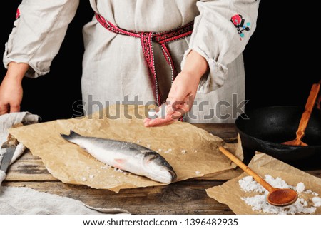 Similar – fresh whole sea bass fish on a black board