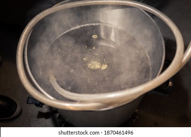 The Fresh Wort In Big Stainless Steel Keg During Process Of Brewing Beer At Home In Garage