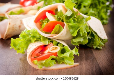 Fresh wrap snadwich with turkey meat and fresh vegetables