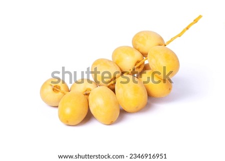 Fresh yellow date palm fruit isolated on white background with clipping path.