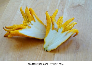 A fresh yellow Buddha’s Hand (Citrus medica var. sarcodactylis) or Fingered citron cut in half