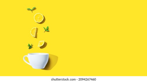 Fresh Yellow Lemons With Tea Cup Overhead View - Flat Lay