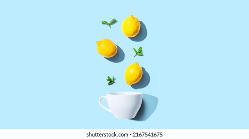 Fresh Yellow Lemons With Tea Cup Overhead View - Flat Lay