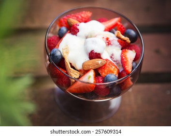 Fresh yogurt with fruits and muesli on breakfast