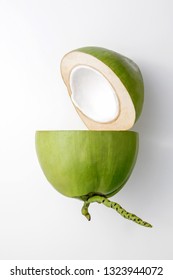Fresh young coconut on a white background, creative healthy food concept, green coconut top view with clipping path