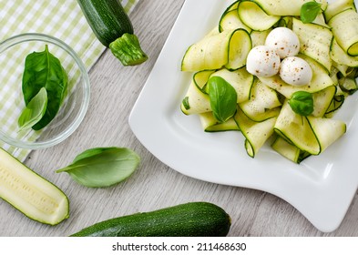 Fresh zucchini and leaves of basil - Powered by Shutterstock