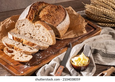 Freshly artisan baked wheat and rye bread, country bread. Simple bread  with butter for breackfast