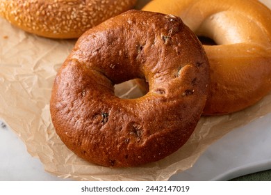 Freshly baked bagels ready to eat for breakfast, sesame, cinnamon and plain bagels