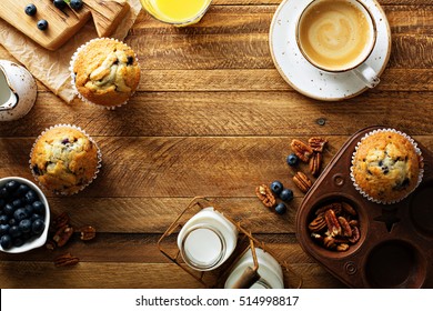 Freshly Baked Blueberry Muffins In A Rustic Setting With Milk And Coffee On The Table Overhead Shot With Copyspace