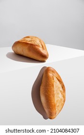 Freshly Baked Bolillo Bread Or French Bread On White Background, In Minimalist Concept, No People