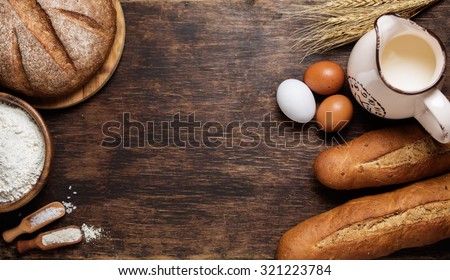 Freshly baked bread and baking ingredients. Food background concept with copyspace