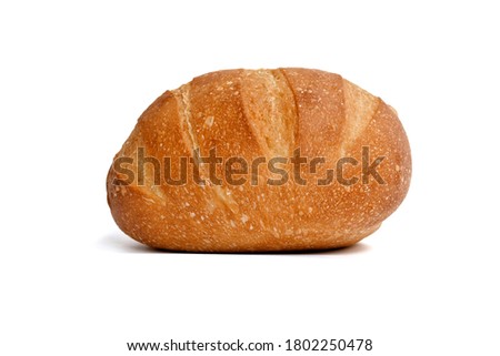 Freshly baked bread, big loaf of brown on white background, food concept