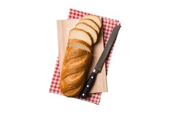 Freshly Baked Bread Cut With Knife Isolated On White Background . Top View Sliced Bread And Knife.