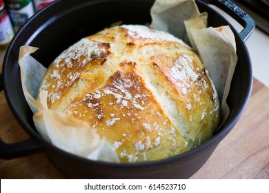 Freshly baked bread just from the oven in cast iron pot.