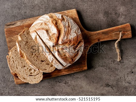 freshly baked bread on dark gray kitchen table, top view