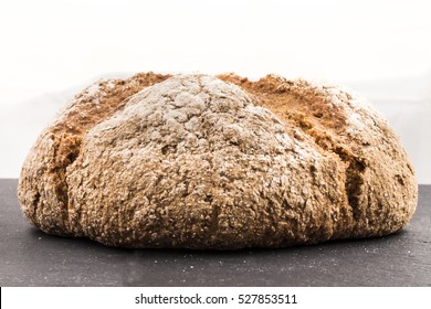 Freshly Baked Brown Irish Soda Bread With Flour On Slate