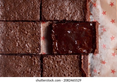 Freshly Baked Brownies On Wax Paper