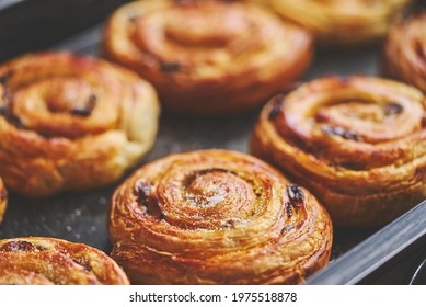 Freshly baked buns with cinnamon and spices. Close-up. Sweet baking concept - Powered by Shutterstock