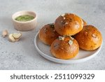 Freshly baked buns (pampushki) with garlic and dill for the first course (soup). National Ukrainian dish, food. Selective focus.